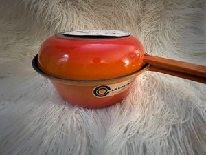 lot 52 image: Le Creuset Multifunction Sauce Pan Skillet Lid in Original Box Number 22 Orange