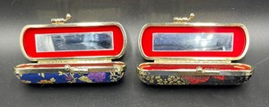 lot 107 image: 2 Classy Fabric Covered Lipstick Cases