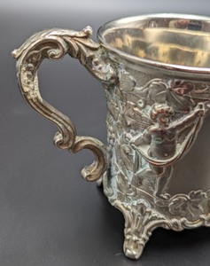lot 23 image: Pair of Silver Plated Cherub Mugs