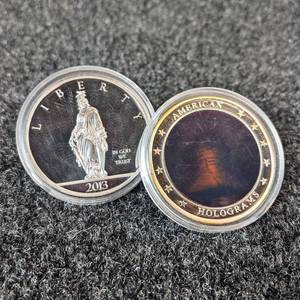 (2) American Mint Collectable Coins - 2013 $1 Trillion Dollar Collector Coin (Copper and Platinum Layered) & Liberty Bell Hologram Collector Coin (Copper and Silver Plated)