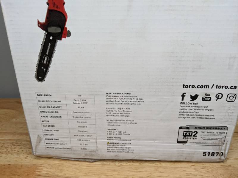 lot 52 image: Brand New Toro 10 in. 60-Volt Lithium Ion Cordless Electric Pole Saw Battery and Charger Included - T