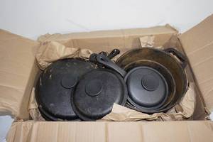 lot 13 image: 8 Piece Cast Iron Pot and Lid Set