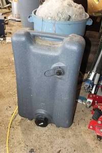 lot 59 image: 12-Gallon Plastic Gas Tote on wheels