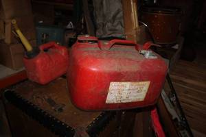 lot 125 image: Lot of (2) Gas Cans - Metal 5-Gallon Boat Gas Can, Plastic 1-Gallon Gas Can