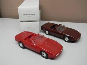 lot 12 image: NEW IN BOX - AMTERTL 125 Scale 1987 CHEVROLET CORVETTE (RED) Promo Car Model &  AMTERTL 125 Scale 1988 CHEVROLET CORVETTE ROADSTER (DARK RED) Promo Car Model - GREAT PIECES - SEE PICTURES