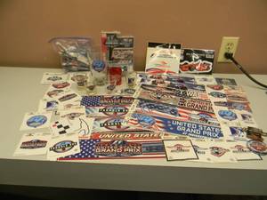 lot 34 image: UNITED STATES GRAND PRIX INDIANAPOLIS FORMULA 1 COLLECTION - BEER GLASS, SHOT GLASSES, LIGHTERS, MAGNETS, DECALS, HAT  LAPEL PINS & MORE - GREAT COLLECTION - SEE PICTURES