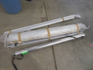 lot 4 image: LARGE ROLL UP DOOR FOR UTILITY TRAILER - NEVER USED