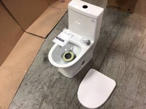 lot 107 image: Sublime II 1-Piece 0.81.28 GPF Dual Flush Elongated Toilet in White by Swiss Madison Customer Returns See Pictures
