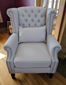 Elegant Designed Tufted Armchair with lovely brad detailing