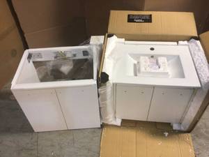 Lot of asorted Bath Cabinets  one with damaged top review pictures customer returns