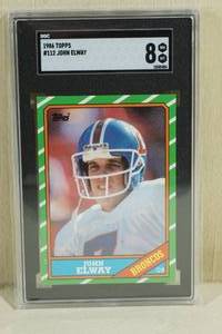 lot 1 image: 1986 Topps John Elway #112 - SGC 8 NMMT