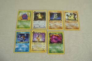 lot 35 image: Red Number 1st Edition Pokemon Cards - Team Rocket, Jungle Expansion
