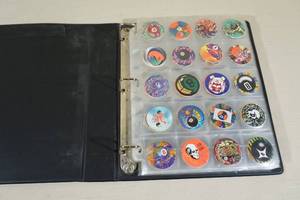lot 183 image: Binder of Collector Pogs