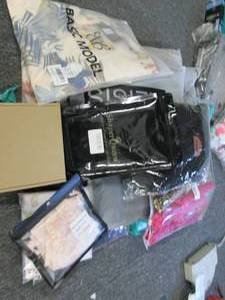 box of womens new various size clot...