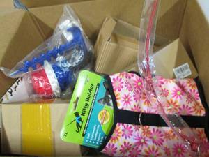 box of dog items, treats , chew toy...