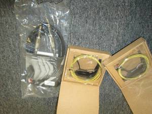 2 packs of guitar strings and a gui...