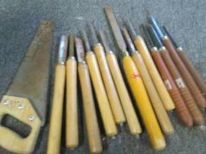 lot of chisels and a hand saw ...