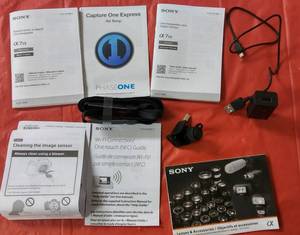 lot 21 image: Sony Q7 Owners Manual & Some Accessories