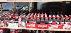 lot 8 image: Collectible Coke Bottles Christmas, Olympics, NASCAR & Super Bowl