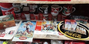lot 9 image: Coca Cola Ceramic Mugs, Calendars, Tray & Signs