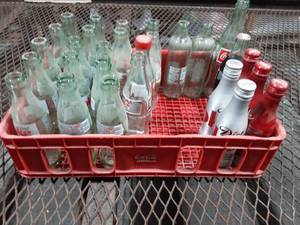 lot 12 image: Plastic Coca Cola Caddy Tray With Old Glass Bottles