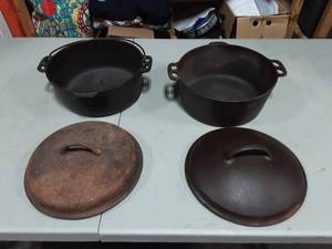 lot 31 image: 2-Cast Iron Dutch Ovens With Lids
