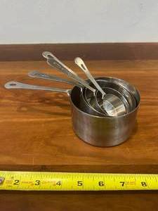 lot 5 image: Stainless Steel Measuring cups. Set of Five. 