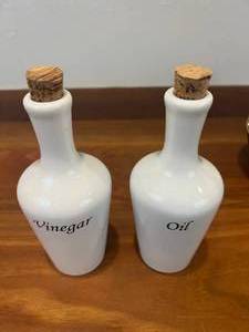 lot 46 image: Vintage White Oil and Vinegar Bottles, Vintage Deluxe Chambord Liquor Bottle, and Crown Royal Bottle with Bag - Contents Untested In All Bottles