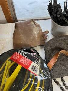 lot 120 image: Work Gloves, Jumper Cables, Leather tool pouch, and more - Look At Those Long Nails