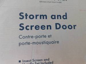 lot 32 image: EMCO 32 in. x 80 in. 300 Series White Universal Triple-Track Aluminum Storm Door