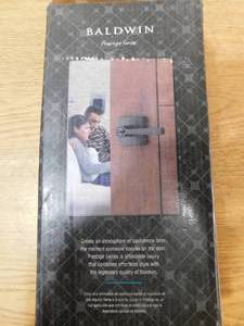 lot 173 image: Baldwin Prestige Spyglass Matte Black BedBath Door Handle with Microban Antimicrobial Technology