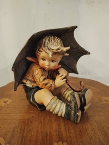 lot 102 image: Umbrella Boy Hummel by Goebel