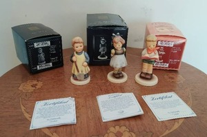 lot 121 image: Garden Treasures, Two Hands, One Tree, and Honor Student Hummel Figurines by Goebel