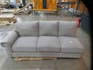 lot 104 image: Abbyson Ferra Sectional Sofa ( Left Facing Sofa Pc OnlyMissing 2 Pcs Small Tear In Fabric) Model SK-5913-SEC-GRY, LAF SOFA Dimensions 86 W X 38 D X 36 H. Slight Tear in Fabric.