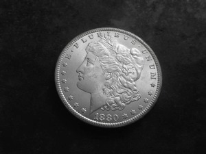 lot 10 image: 1880 CC Silver Morgan Dollar