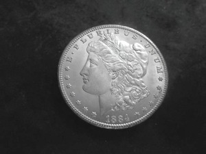 lot 25 image: 1884 CC Silver Morgan Dollar