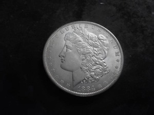 lot 26 image: 1884 O Silver Morgan Dollar