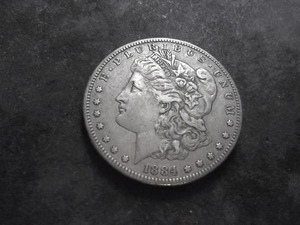 lot 27 image: 1884 S Silver Morgan Dollar