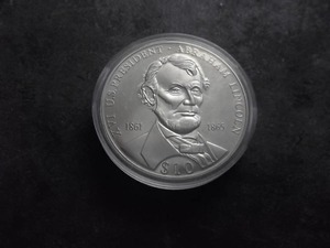 lot 88 image: Abraham Lincoln $10 Silver Commemorative Half Oz.