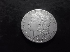lot 33 image: 1886 O Silver Morgan Dollar