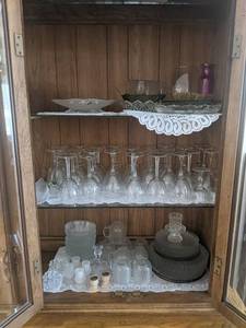 Glass Serving Dishes and More - Contents on RIGHT Side of Cabinet - Cabinet NOT Included - Please bring boxes as none will be available at the auction - NO SHIPPING