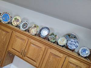 Lot of Collectible Plates and Stands on top of Cupboards - Includes all Pieces shown in pics - Cupboard NOT Included - NO SHIPPING