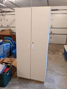 White Storage Cabinet - Measures 30 Wide x 16 Deep x 72 High - Please bring help to remove - This is located in the Attached Garage - NO SHIPPING ON THIS AUCTION