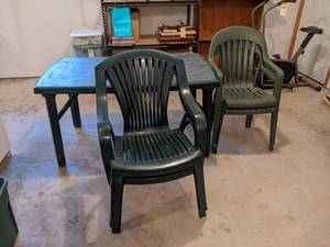 Plastic Patio Table w 4 Chairs - Table measures about 55 x 33 x 29 - NO SHIPPING
