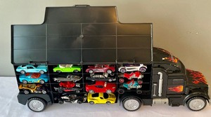 lot 47 image: Semi Truck Carrying Case with 28 Cars
