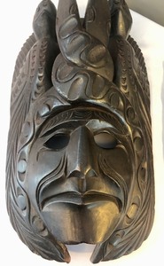 Two Unique Carved Wooden Wall Masks