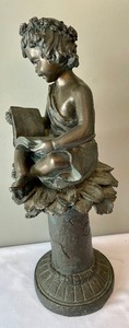 Resin Sculpture of Child Reading a Book