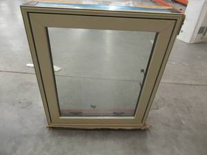 24 x 27 Left Hinge Casement Window - Missing Crank Cover. Tan Exterior and Dark Pine Interior.