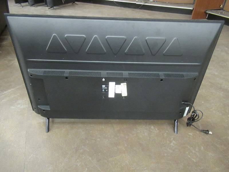 lot 129 image: TCL 40S325 40 Inch 1080p Smart LED Roku TV, No Remote - Deep Cuts Just Left of Center. (See Photo).
