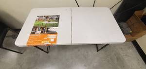 lot 615 image: Lifetime 4 ft. Adjustable Height Fold in Half Table in White - Scratch & Dent